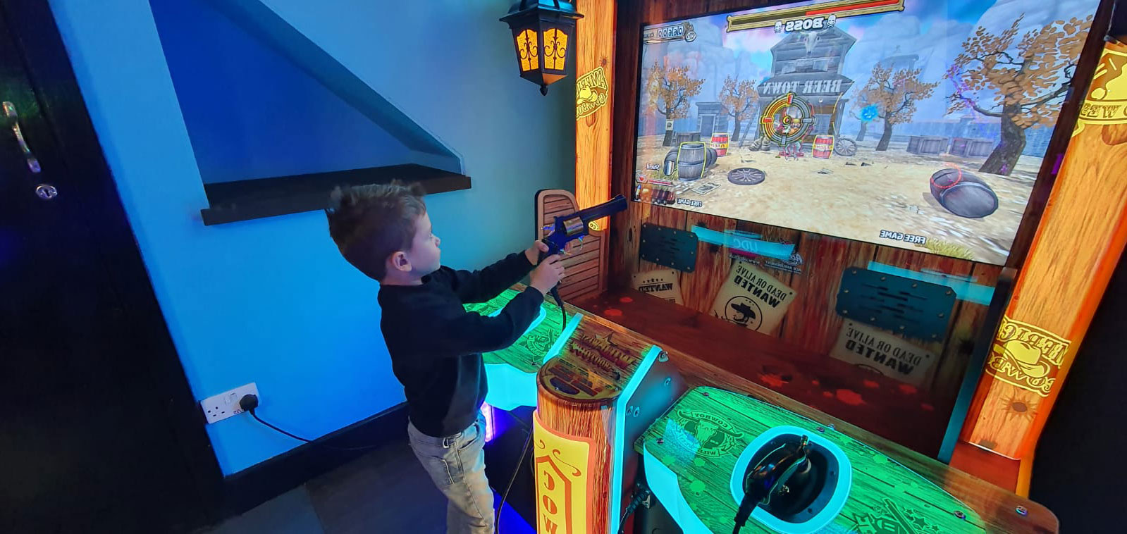 Young couple playing driving arcade game