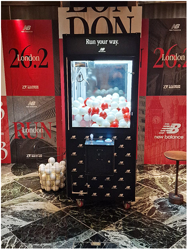 New balance branded prize grabber arcade machine available for hire