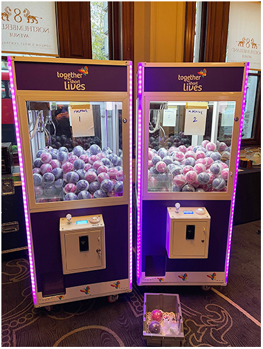 Together For Short Lives Arcade Claw Machines Prize Grabber available for rent